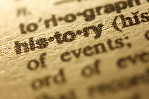 Word history written on a brown paper